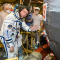 13-08-14_At the Baikonur Cosmodrome in Kazakhstan, Expedition 40_41 Flight Engineer Reid Wiseman of NASA poses for a picture May 16 in his Russian Sokol launch and entry suit as he enters the Soyuz TMA-13M space_o.jpg