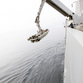 crane-lowers-inflatable-boat_13290901654_o.jpg