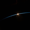 the-sun-peeks-above-the-earths-horizon_52099041524_o.jpg