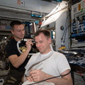 expedition-60-flight-engineer-andrew-morgan-trims-the-hair-of-fellow-nasa-astronaut-nick-hague_48475382127_o.jpg