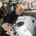 iss047e032108-astronaut-tim-kopra-inspects-space-suit_26180884712_o.jpg