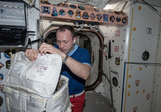 cosmonaut-alexander-misurkin-checks-stowage-bag 8617683968 o